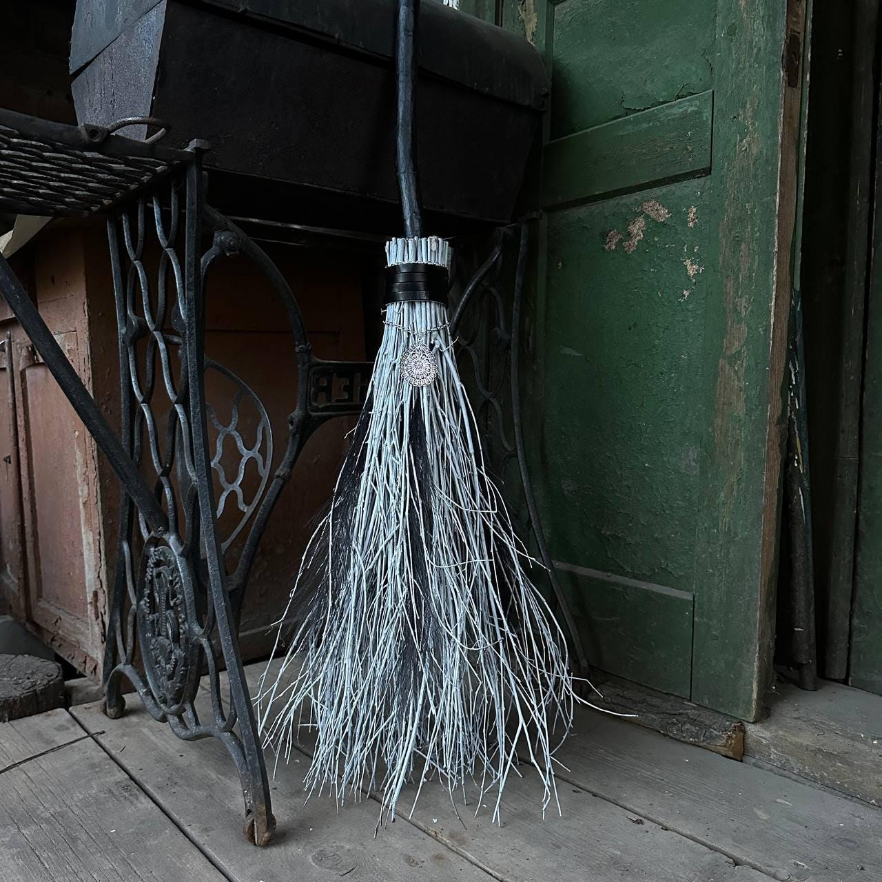 Feather-decorated witch broom for rituals and ceremonies – USA shipping available