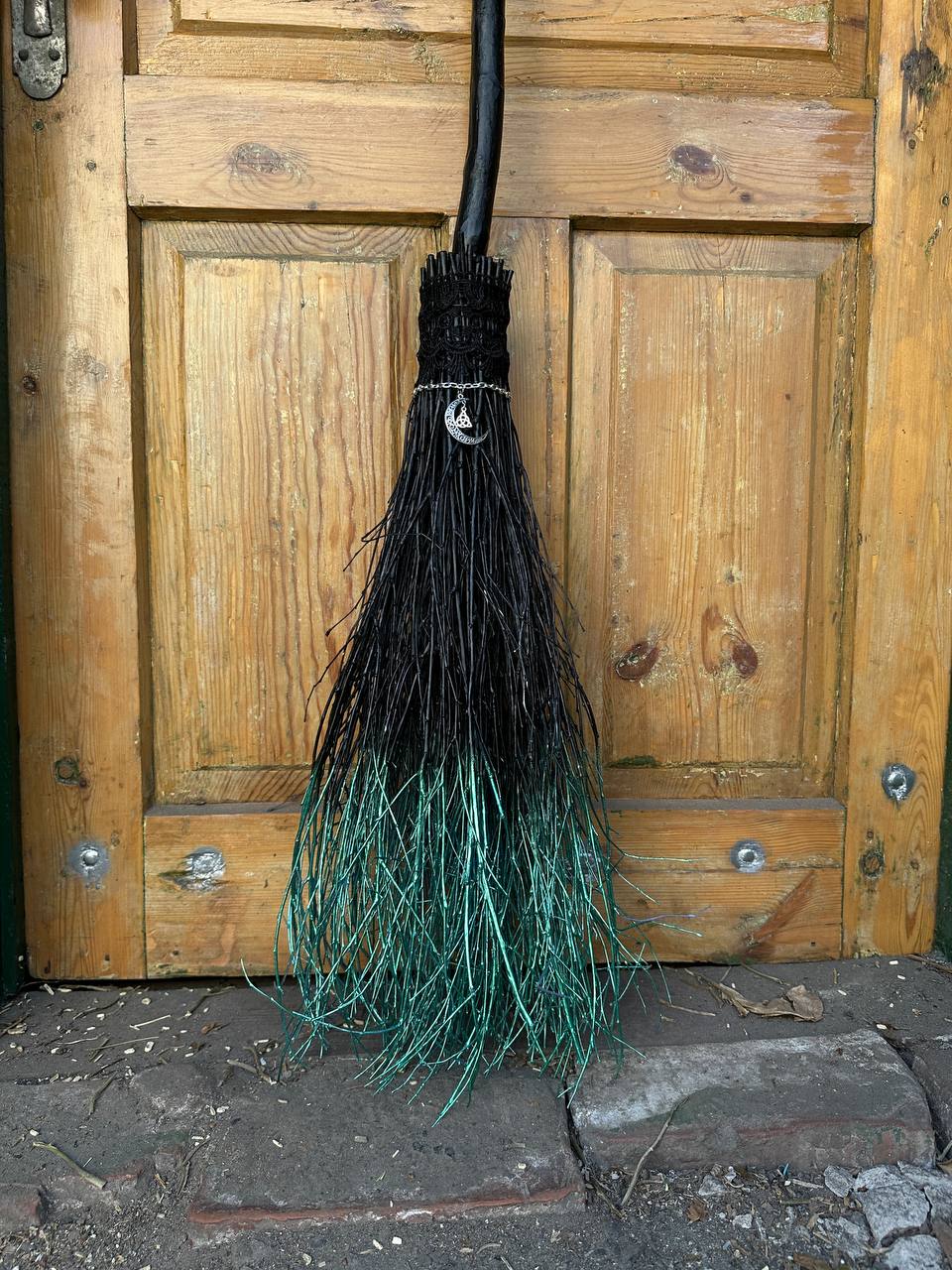 Full-size black witch broom for Halloween decoration