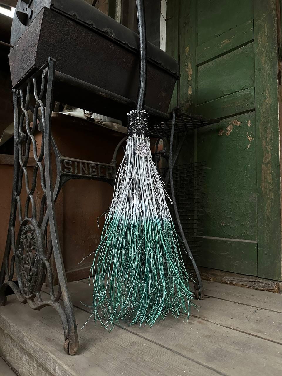 White and Metallic Green Witch Broom With Lace And Pendant