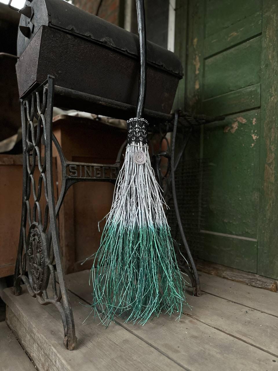 White and Metallic Green Witch Broom With Lace And Pendant