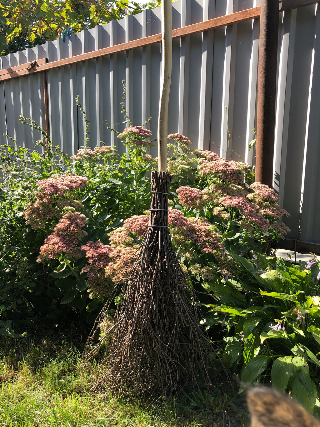 Full length witches broom for Halloween decor in USA