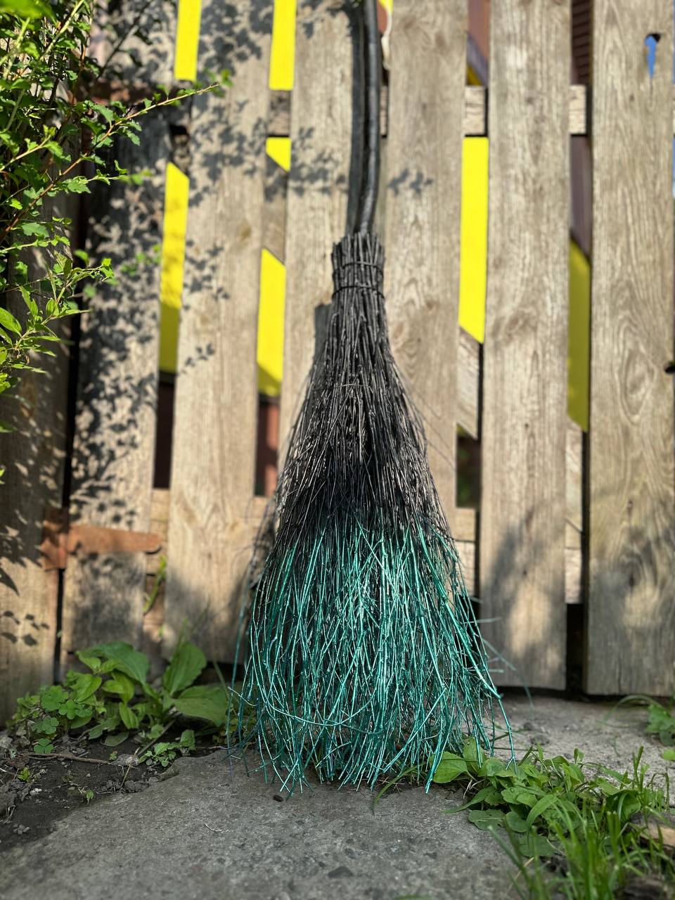 Decorative broom with green bristles 