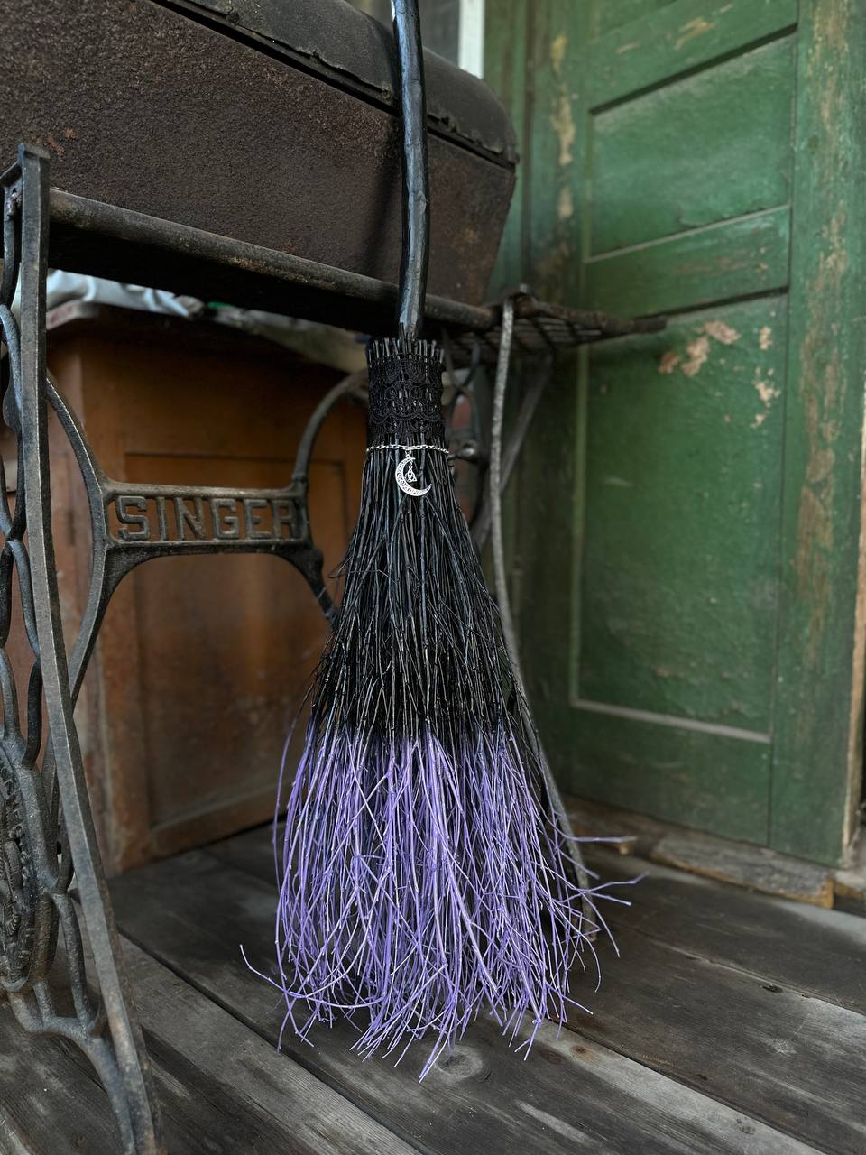 Decorative natural witches broom with black and purple bristles